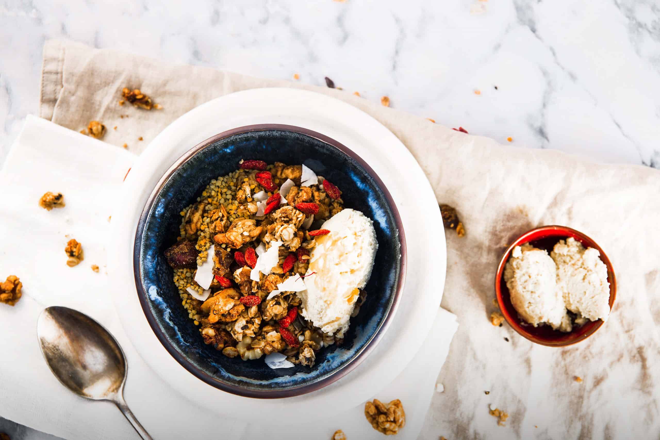 chai addict spiced granola in a bowl with yoghurt
