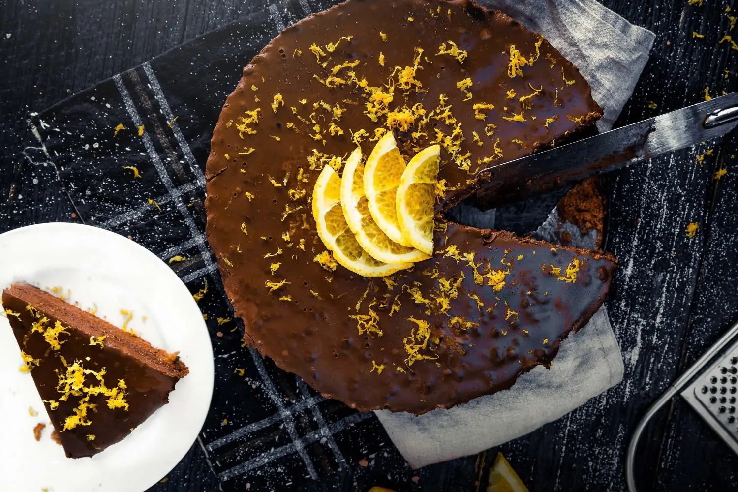 Slices of Choc-Chai Orange Fantasy Cake with shaved orange zest