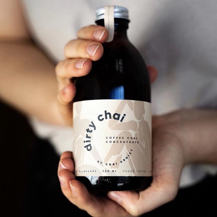 Person holding Chai Addict's Dirty Chai concentrate