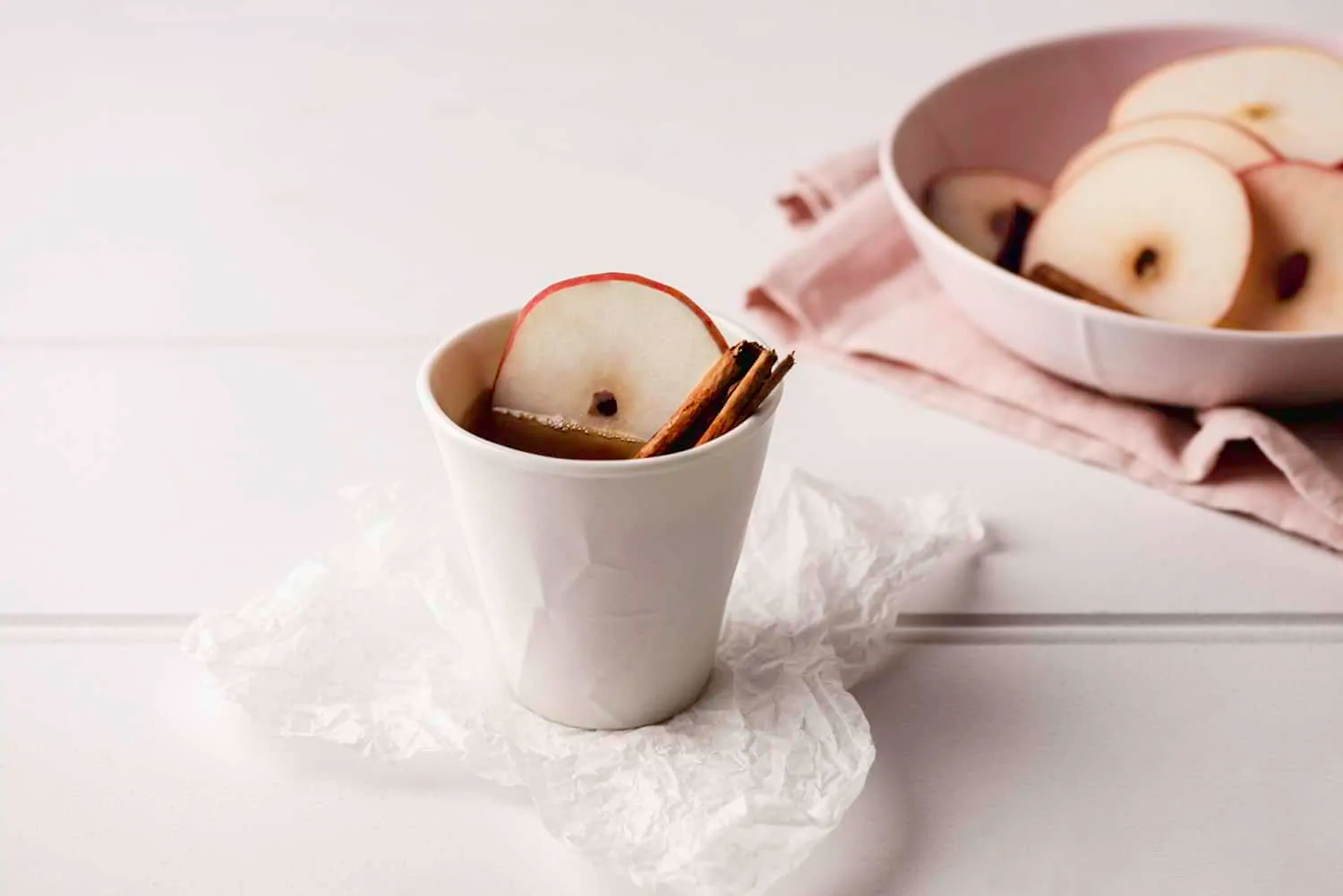 a cup of the quickest masala chai tea with apple slices