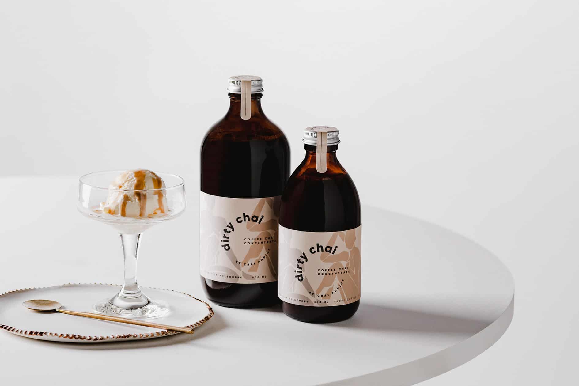 dirty chai coffee chai concentrate in 300ml and 500ml next to an affogato dessert