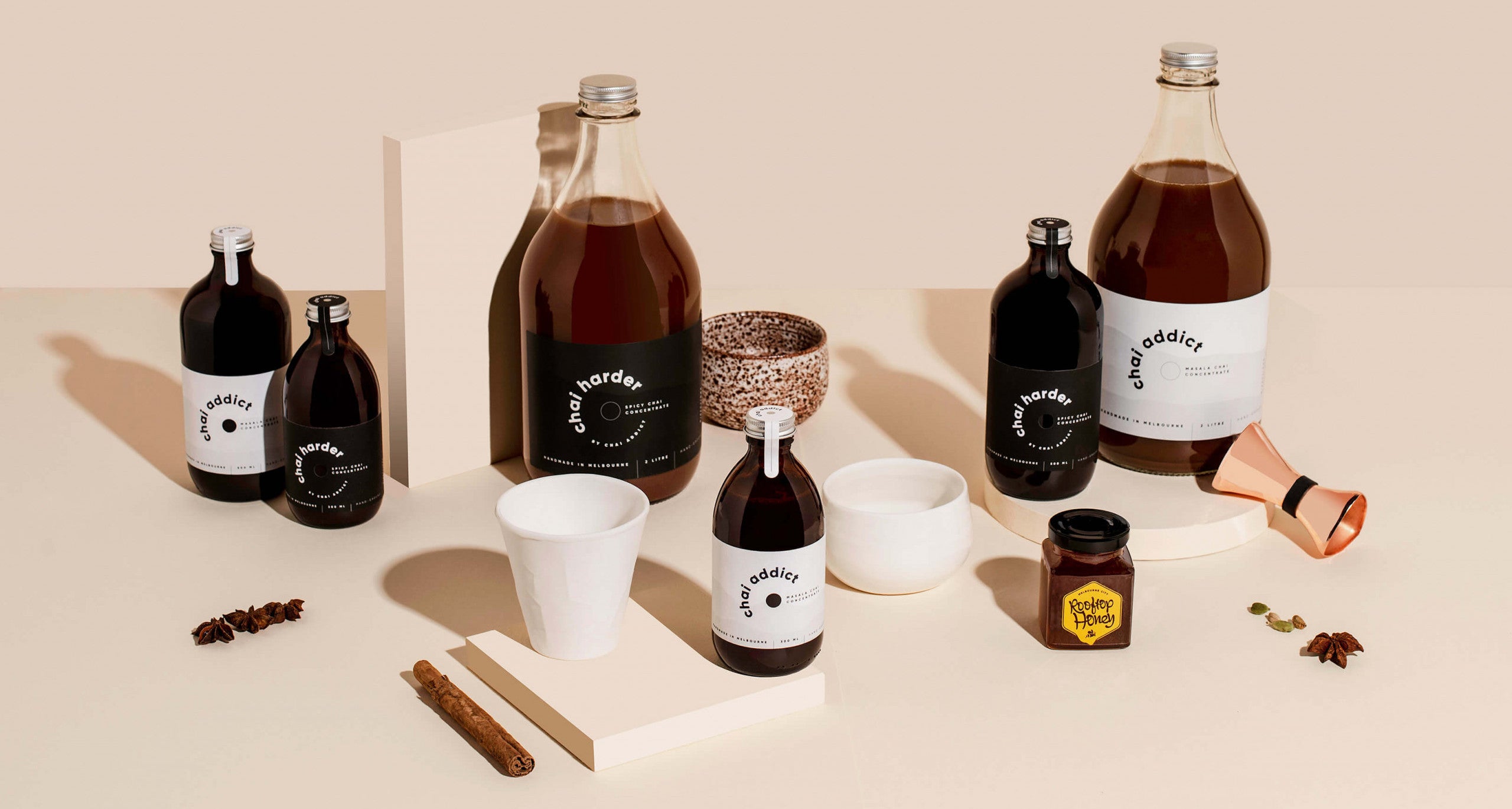 Assorted chai latte concentrate bottles arranged in a captivating banner, offering a delightful variety for chai enthusiasts