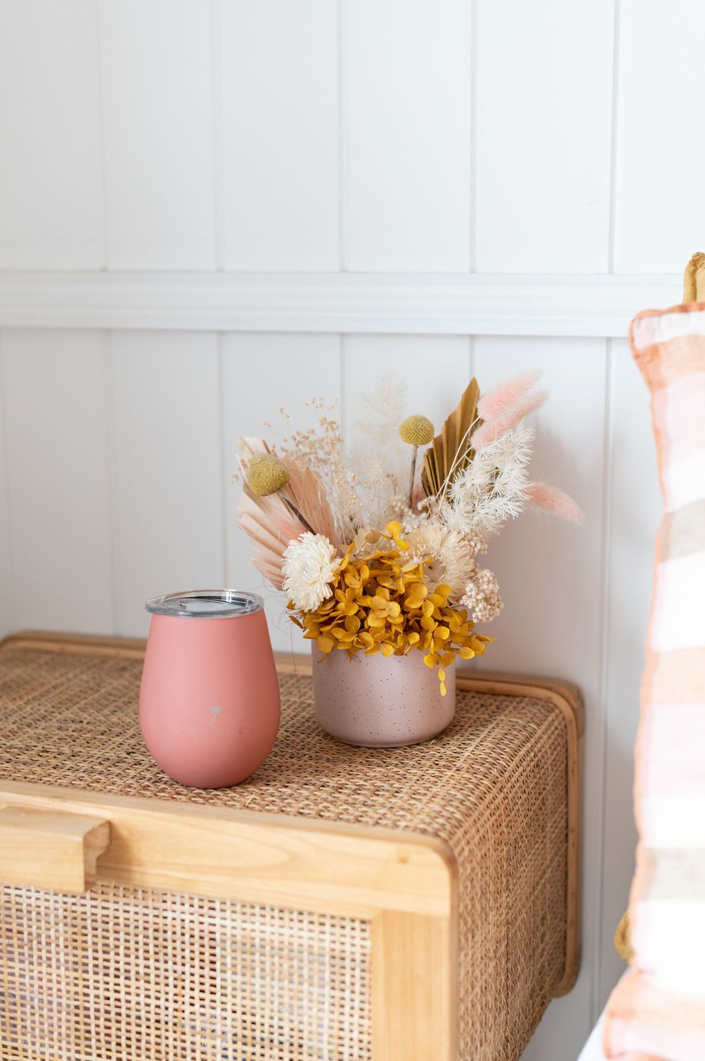 caye life terracotta keep cup sitting on rattan buffet